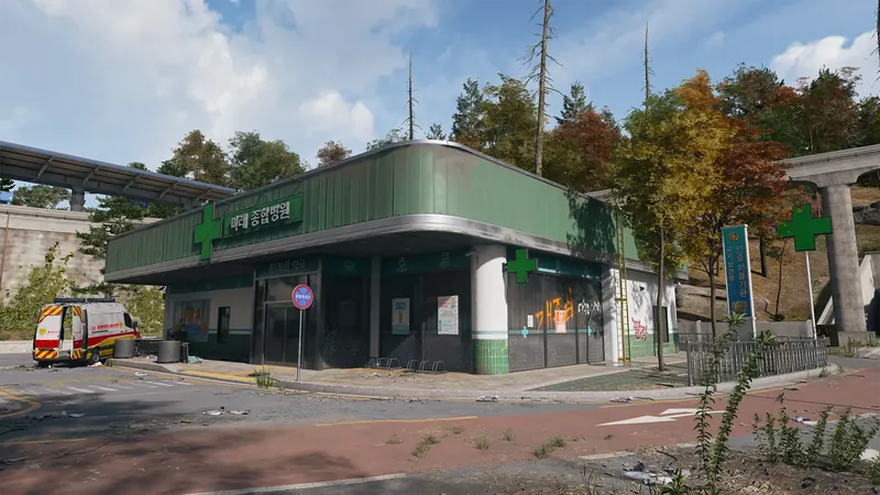 Green and white medical clinic with Korean signage, green crosses, graffiti, and an ambulance parked outside.